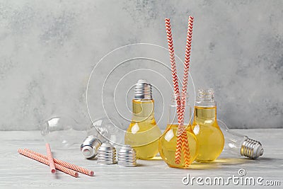 Apple juice in cute light bulb jars Stock Photo