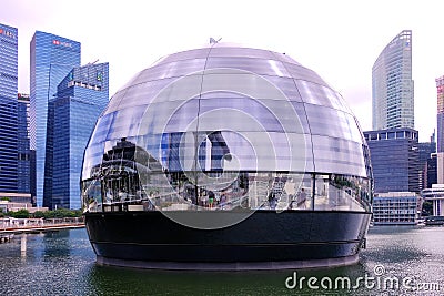 Apple Marina Bay Sands, the first Apple Store to sit directly on water opens today. The all-glass spherical dome structure is Editorial Stock Photo