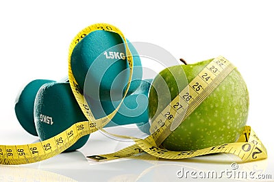 Apple, measuring tape and dumbbells isolated Stock Photo