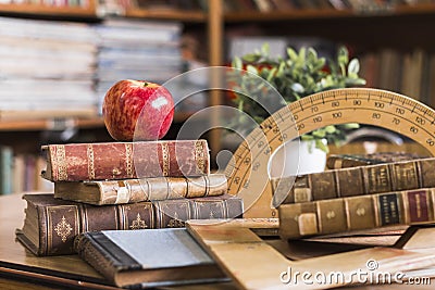 apple near books geometry tools. High quality photo Stock Photo