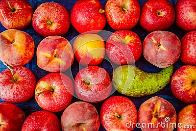 Apple with nectarine, peach and pear on blue background, raw healhy food concept Stock Photo