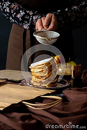 Apple Pancake Bag Craft Box Delivery chif dessert black background Hands food Stock Photo