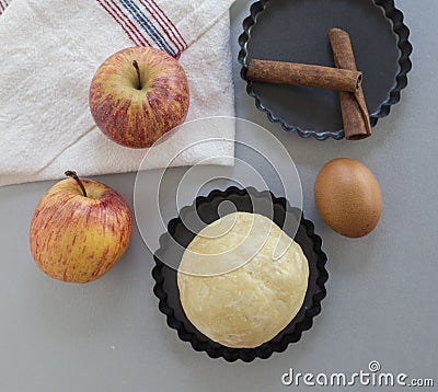 Apple pie ingredients. Dough, apple slices Stock Photo