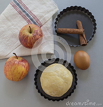 Apple pie ingredients. Dough, apple slices Stock Photo