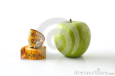 Apple and rolled meter next to it healthy lifestyle concept Stock Photo