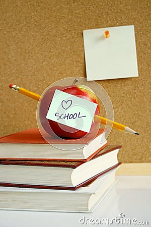 Apple on school books Stock Photo