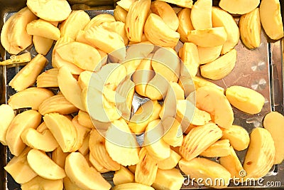 Apple sliced into many pieces on a stainless steel tray Stock Photo