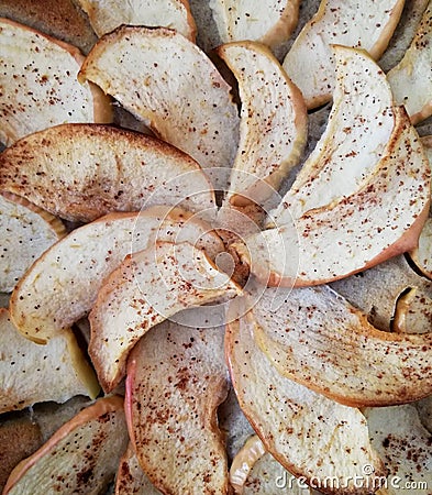 The Apple slices for pie with cinnamon and kitchen herbs Stock Photo