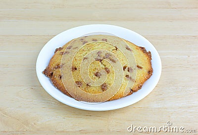 Apple spice muffin top on a plate atop a table Stock Photo