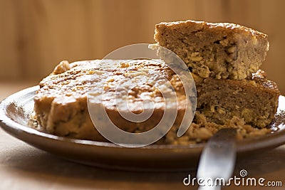 Apple sponge cake, walnuts, flour, sugar, oil and raisins. Stock Photo