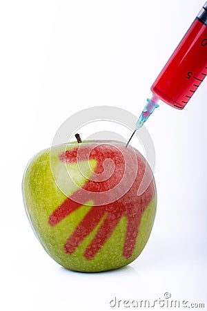 Apple with syringe Stock Photo