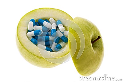 Apple with tablets capsules. Stock Photo