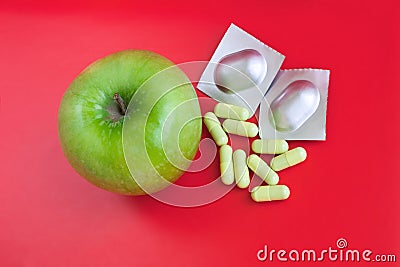 Apple and tablets over bright red background Stock Photo