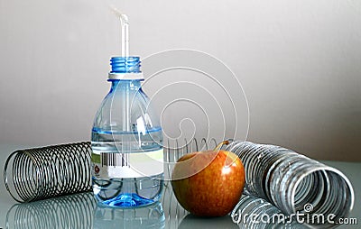 Apple water and spring on a gray background Stock Photo