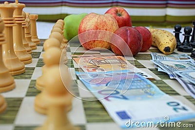 apples and bananas on the chess board Stock Photo