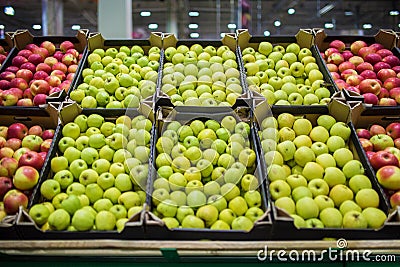 Apples in the cardboard boxes on the grocery shelf Stock Photo