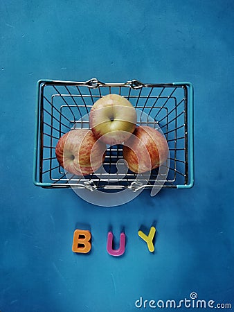 Apples inside little shopping basket Stock Photo