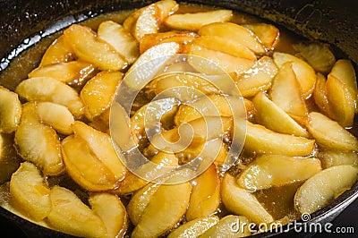 Apples slices being carmelized for dessert Stock Photo