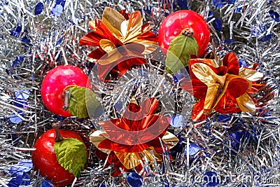 Apples and stars on a blue and silvery tinsel Stock Photo