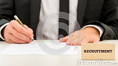 Applicant completing a job application Stock Photo