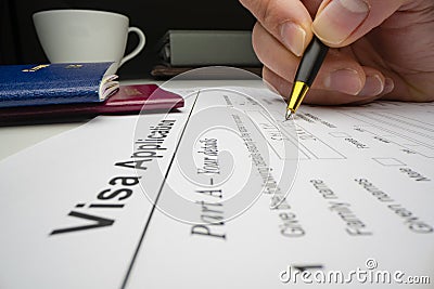 Applicant completing visa application form Stock Photo