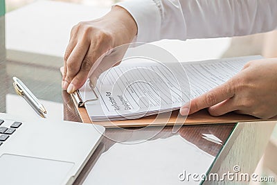 Applicant filing in company application form document applying for job, or registering claim for health insurance Stock Photo