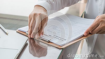 Applicant filing in company application form document applying for job, or registering claim for health insurance Stock Photo