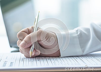 Applicant filling in business company application form document applying for job, or registering claim for health insurance Stock Photo