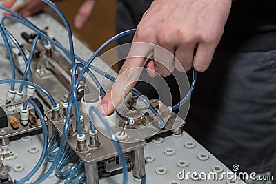 Trigger pneumatics application with the push of a button Stock Photo