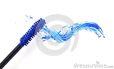 Applicator and blue mascara smear on white background, top view Stock Photo