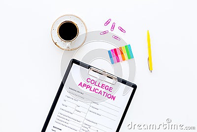 Apply college. Empty college application form near coffee cup and stationery on white background top view space for text Stock Photo