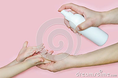 Apply spray hand sanitizer against the virus, bacteria to the child Stock Photo