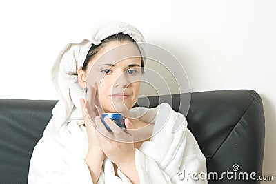 applying face cream Stock Photo