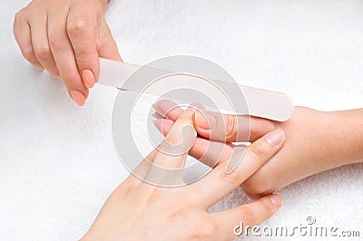 Applying manicure with nail-file Stock Photo