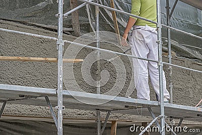 Applying mortar with the spray gun 2 Stock Photo