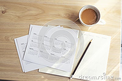 Appointment Calendar Concept. Desktop Calender, Diary, Coffee place on business office desk, work at home. Notebook for Planner Stock Photo