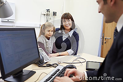 Appointment For Mother And Daughter With Doctor Stock Photo