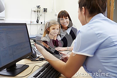 Appointment For Mother And Daughter With Nurse Stock Photo