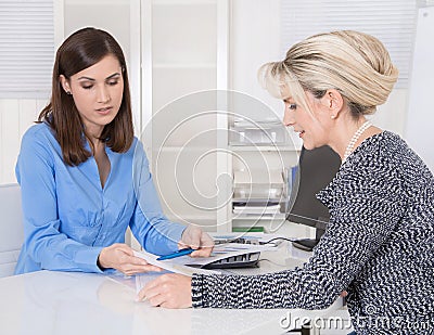 Appointment at a specialist for finance: female customer and adv Stock Photo