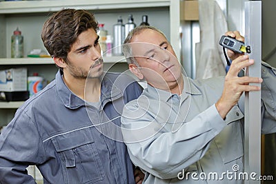 Apprentice with new boss on first day Stock Photo