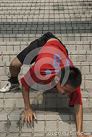 Apprentice monks train on steep steps in in Kaohsiung City, Taiwan Editorial Stock Photo