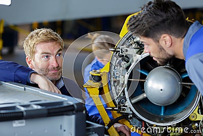 apprentices aeronautical engineers learning with their professor Stock Photo