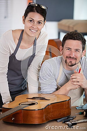 apprenticeship in guitar work shop Stock Photo