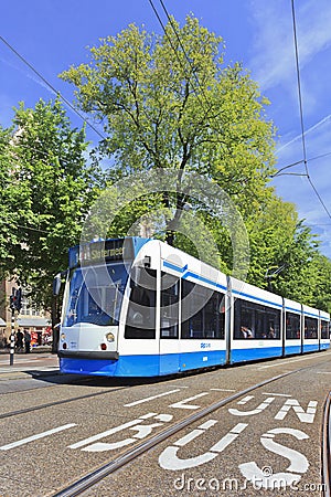 Approaching tram in Amsterdam Old Town Editorial Stock Photo