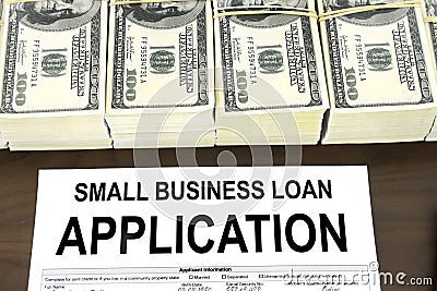 Approved small business loan application form and money Stock Photo