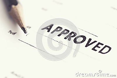 Approved stamp on white paper Stock Photo