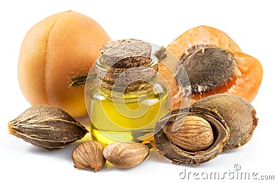 Apricot kernel oil and apricot kernels isolated on the white background Stock Photo