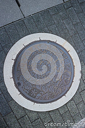 Circle steel manhole cover or metal sewer in Nogoya city, April 6 2019, Japan Stock Photo