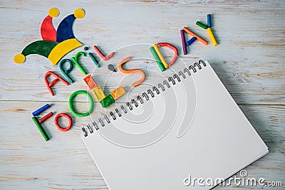 April Fools` Day text made with plasticine and free space in note Stock Photo