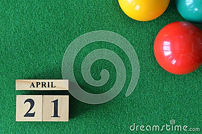 April 21, number cube with balls on snooker table, sport background. Stock Photo